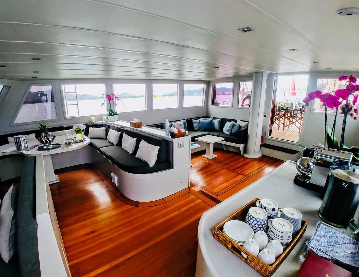 a living room with a large window aboard VITA DOLCE Yacht for Sale