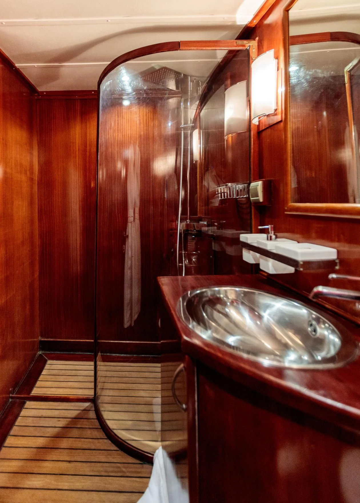 a bathroom with a sink and a mirror aboard VITA DOLCE Yacht for Sale