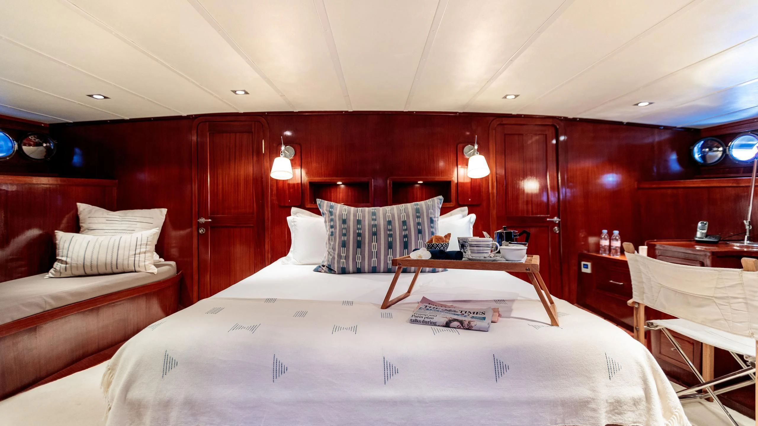 a room with a bed and a couch aboard VITA DOLCE Yacht for Sale