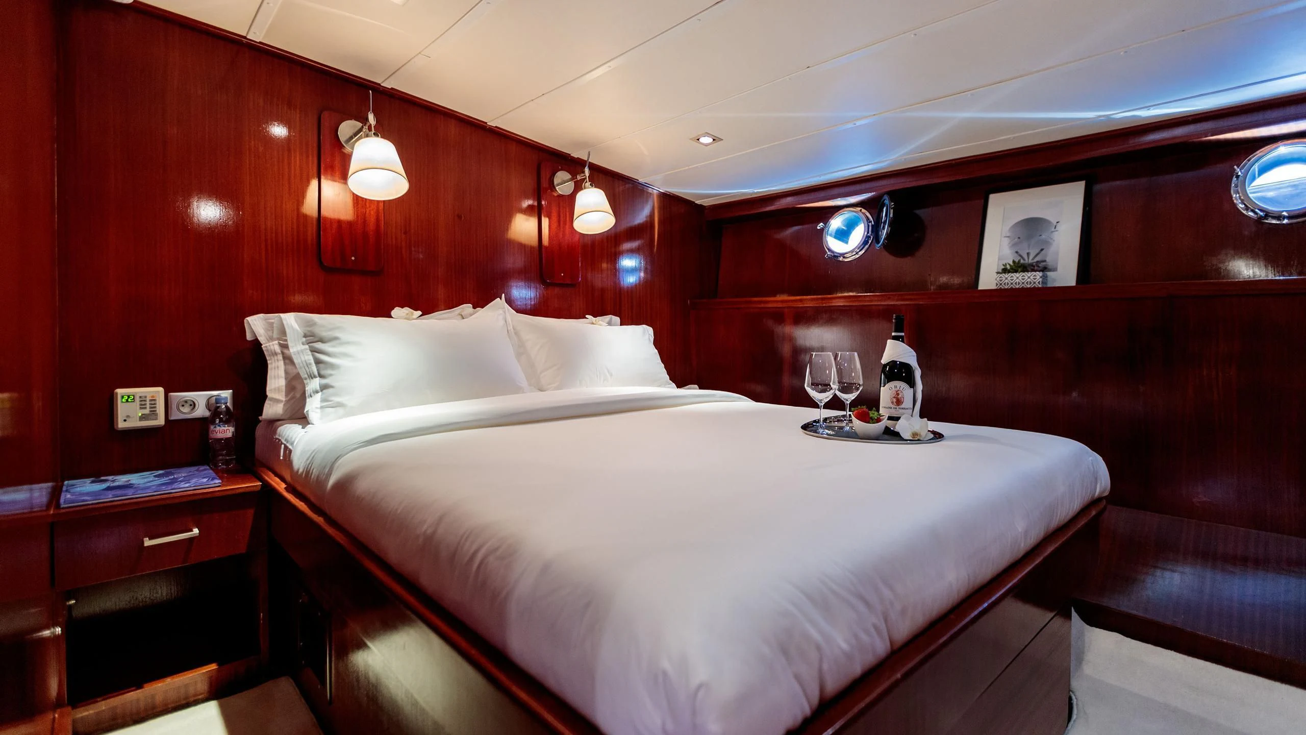 a bed with white sheets and pillows aboard VITA DOLCE Yacht for Sale