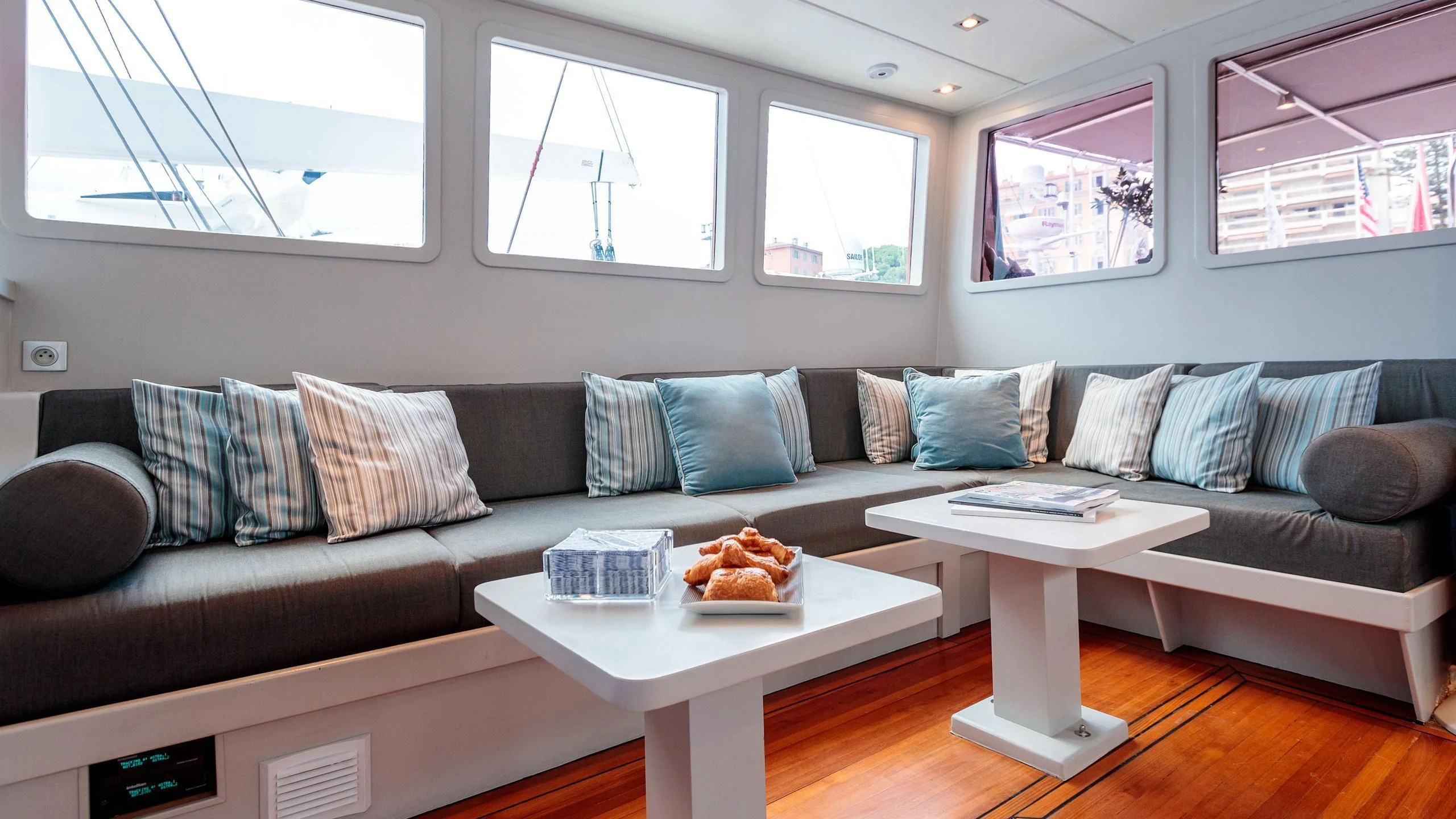 a couch with a coffee table aboard VITA DOLCE Yacht for Sale