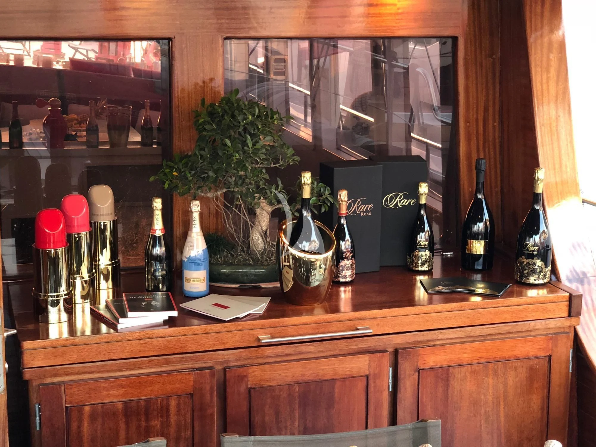 a bar with bottles and glasses aboard VITA DOLCE Yacht for Sale