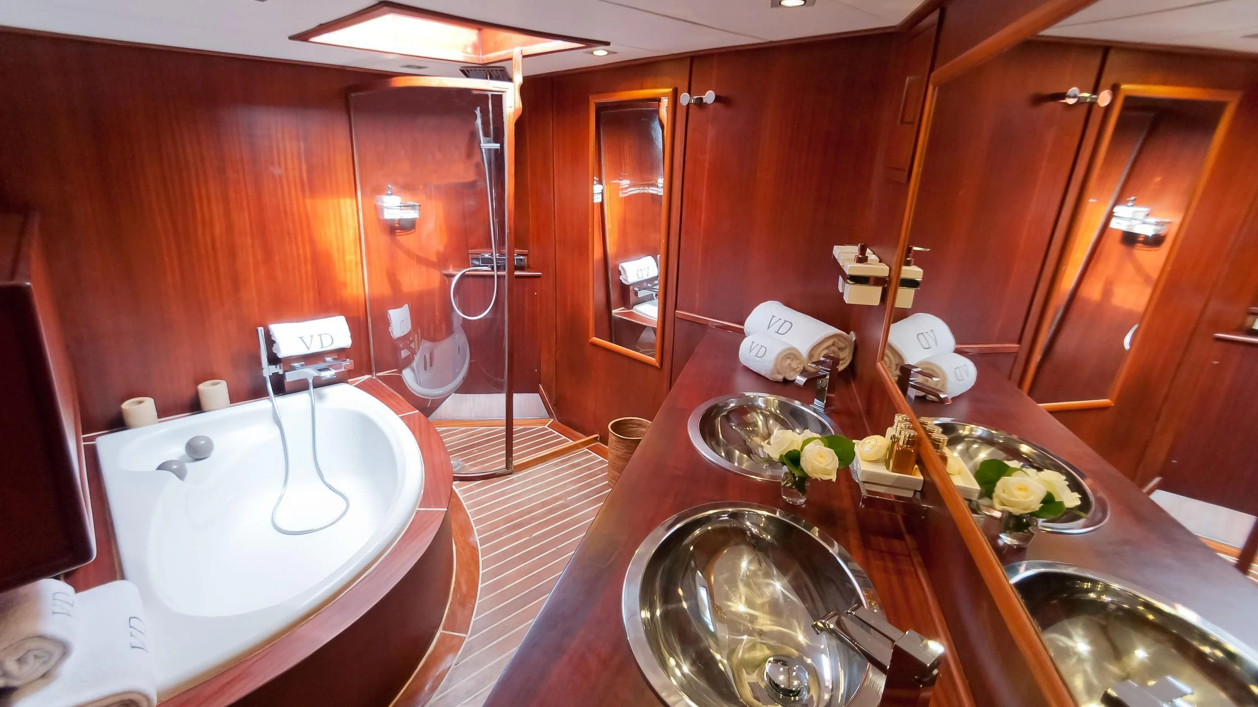 a bathroom with a sink and a bathtub aboard VITA DOLCE Yacht for Sale