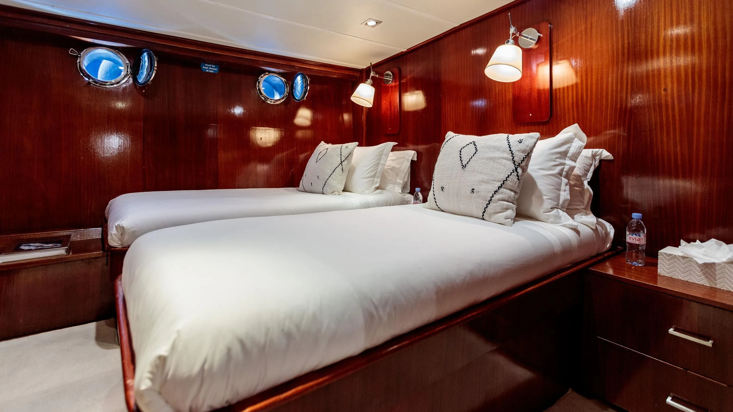 a bed with white sheets aboard VITA DOLCE Yacht for Sale