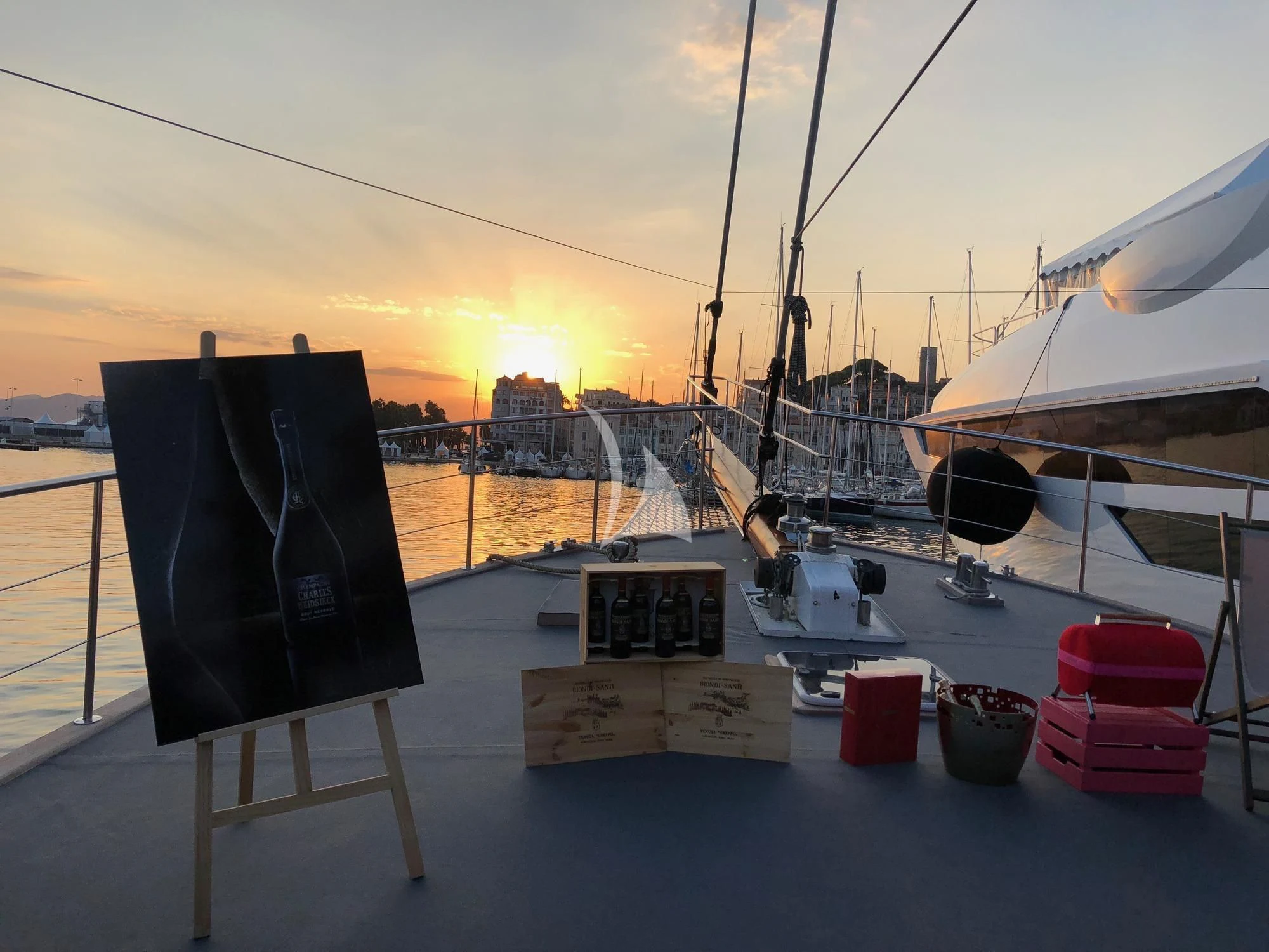 a table with a chair on it by a body of water aboard VITA DOLCE Yacht for Sale