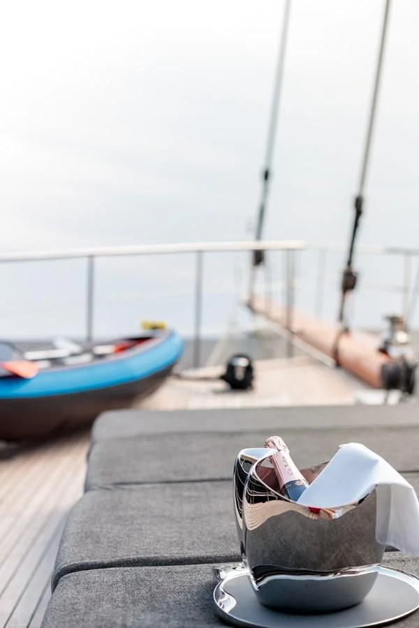 a chair on a deck by a boat aboard VITA DOLCE Yacht for Sale