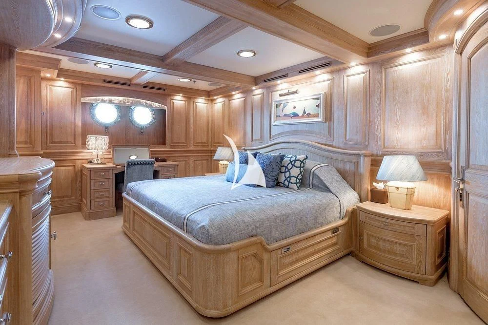 a large bedroom with a large bed aboard NERO Yacht for Sale