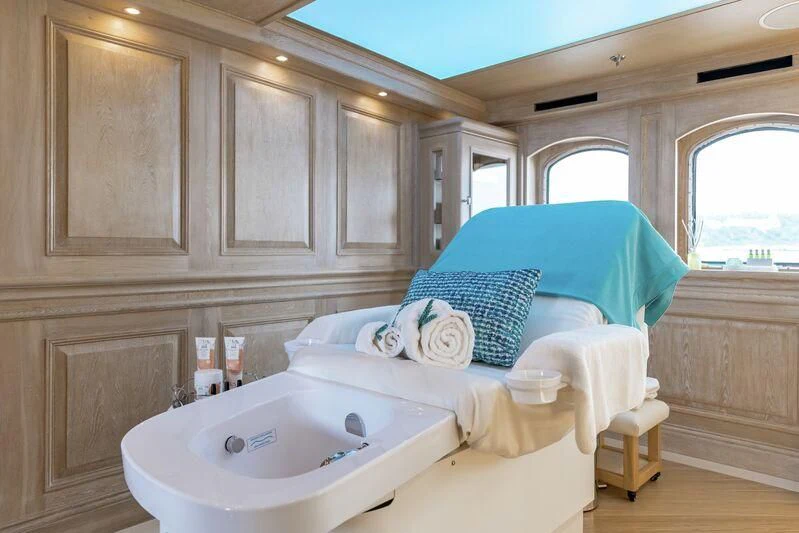 a bathroom with a bed and a sink aboard NERO Yacht for Sale