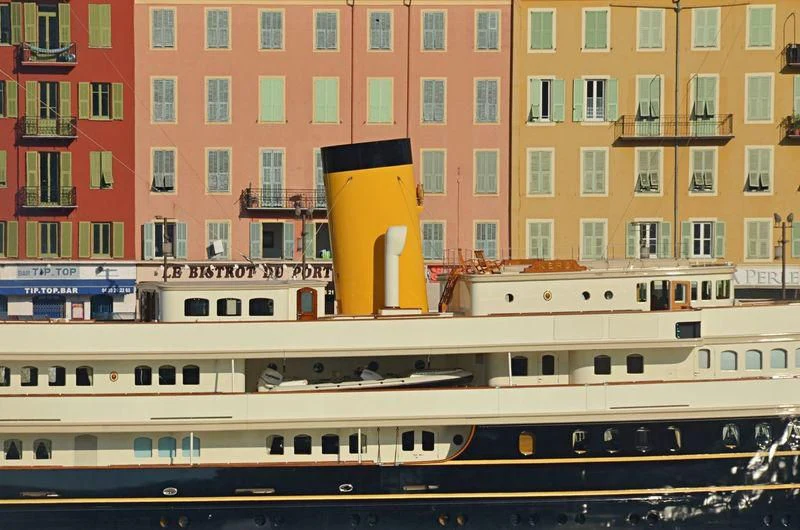 a yellow and red building with windows aboard NERO Yacht for Sale