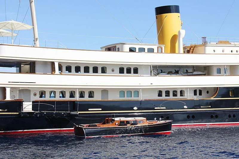 a large boat docked at a pier aboard NERO Yacht for Sale
