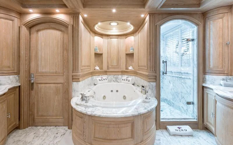 a bathroom with a large tub aboard NERO Yacht for Sale