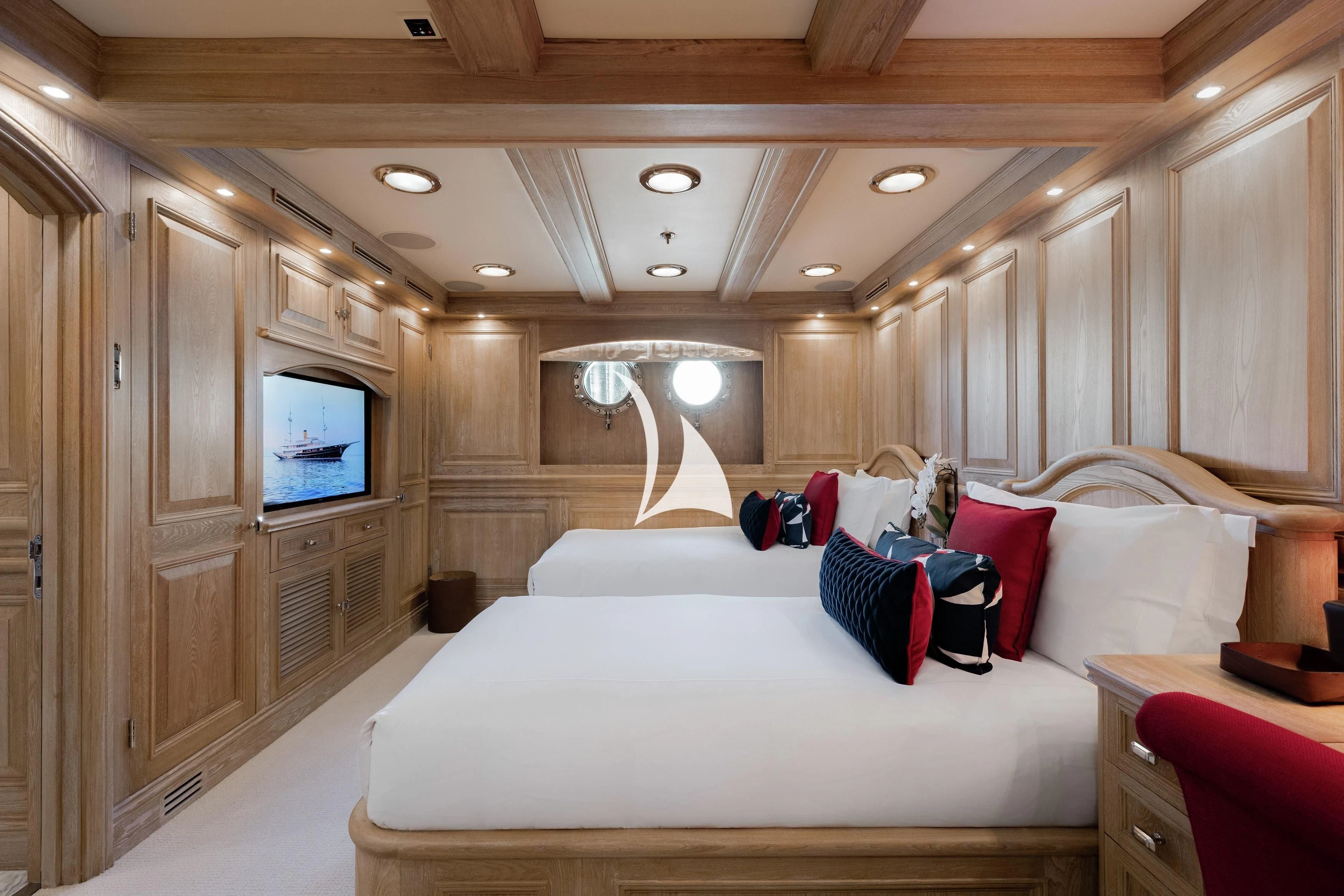 a room with a bed and a television aboard NERO Yacht for Sale