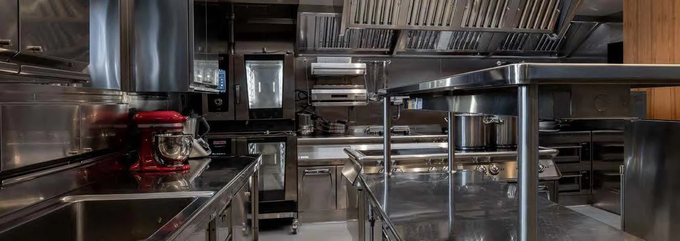 a kitchen with stainless steel appliances aboard NERO Yacht for Sale