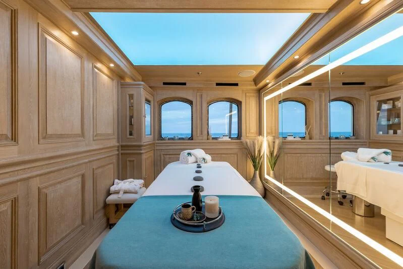 a room with a bed and a table aboard NERO Yacht for Sale