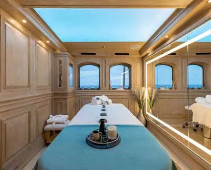 a large white table with a black lamp on it aboard NERO Yacht for Sale