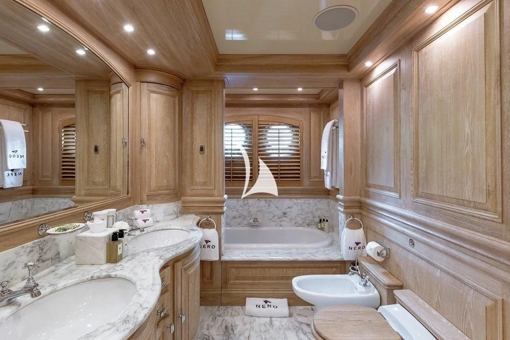 a bathroom with a large tub aboard NERO Yacht for Sale