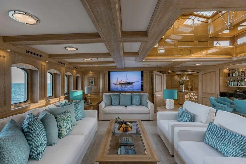 a living room with a large screen aboard NERO Yacht for Sale