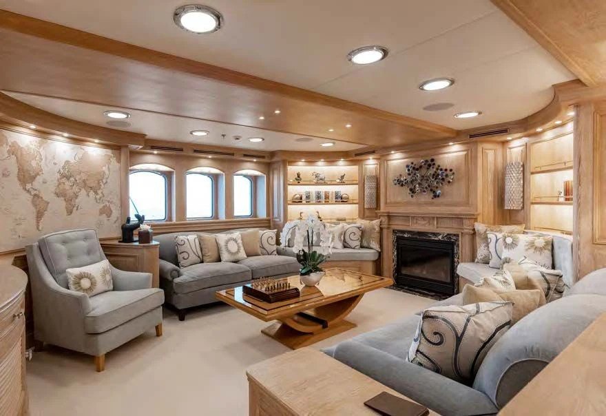 a living room with a fireplace aboard NERO Yacht for Sale