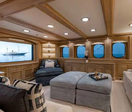 a living room with a couch and a tv aboard NERO Yacht for Sale