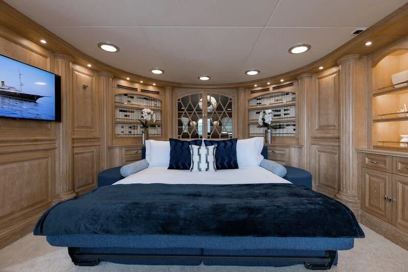 a large bedroom with a large bed aboard NERO Yacht for Sale