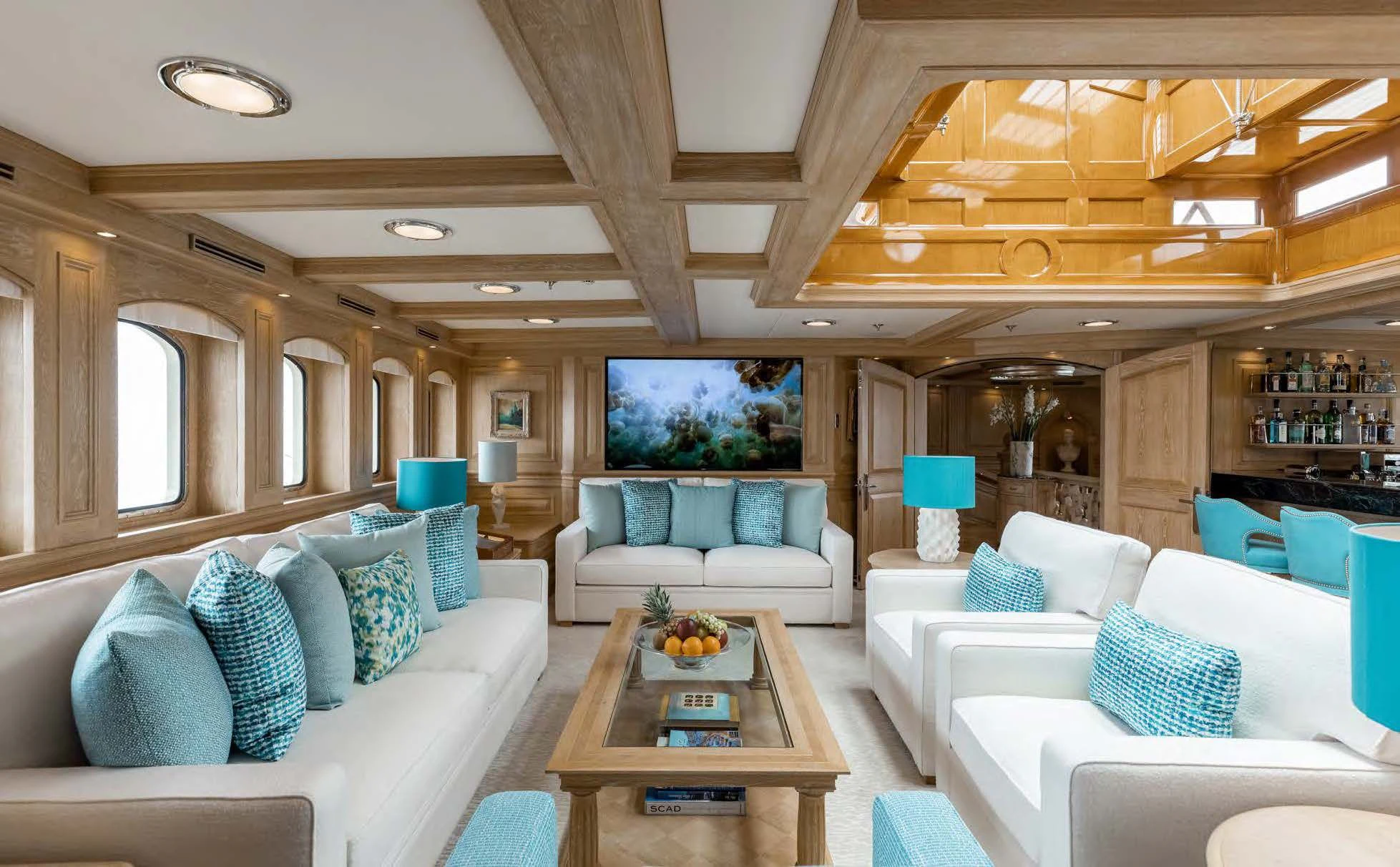 a living room with a couch and a coffee table aboard NERO Yacht for Sale