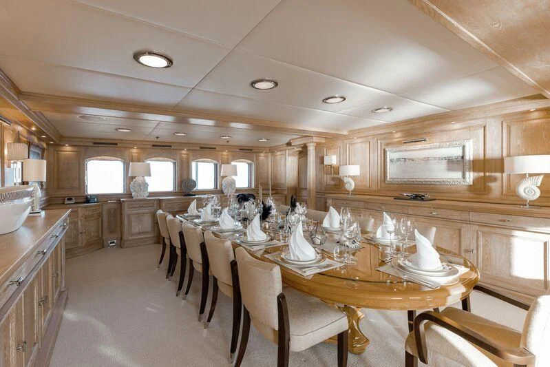 a large kitchen with a dining table aboard NERO Yacht for Sale