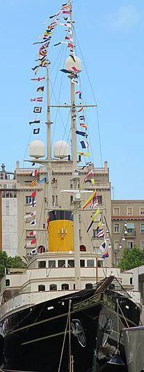 a boat with flags aboard NERO Yacht for Sale