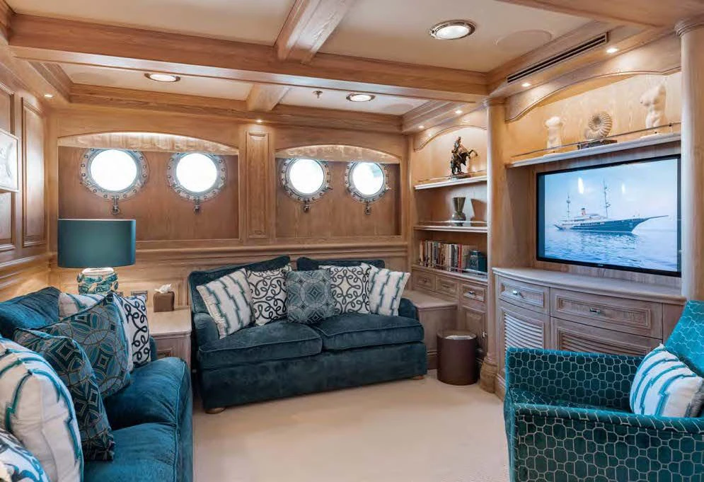a living room with a large screen aboard NERO Yacht for Sale