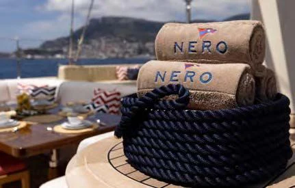 a hat on a table aboard NERO Yacht for Sale