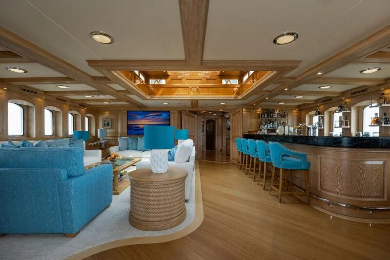 a room with a couch and a table and chairs aboard NERO Yacht for Sale