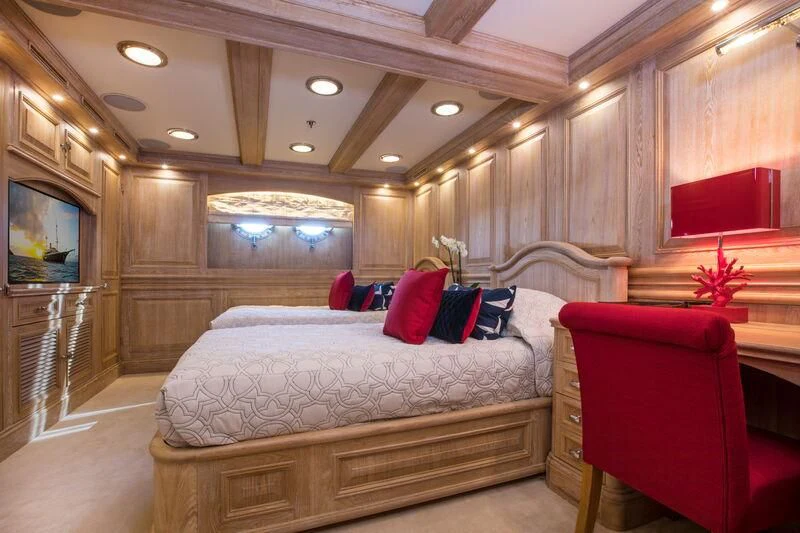 a room with a bed and a tv aboard NERO Yacht for Sale