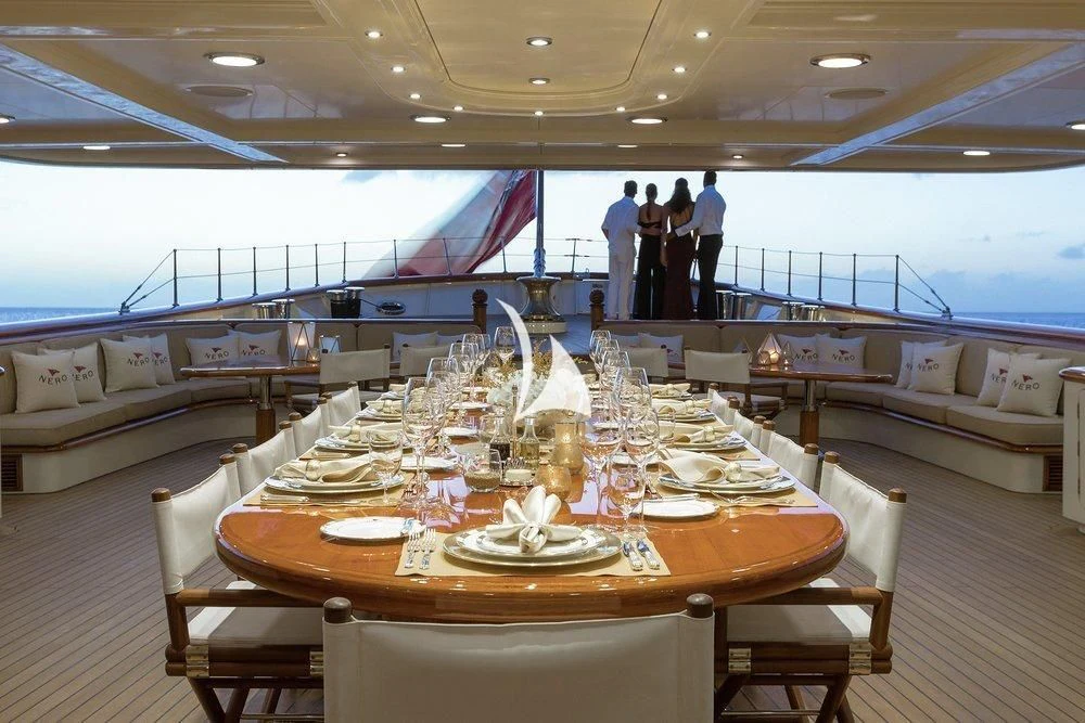 a table set for a dinner party aboard NERO Yacht for Sale