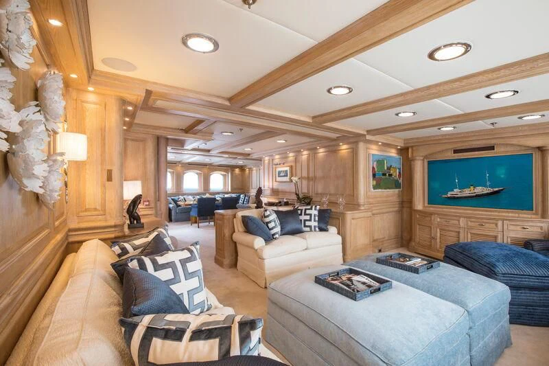 a living room with a large screen aboard NERO Yacht for Sale