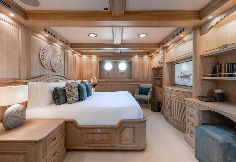 a bedroom with a bed and a tv aboard NERO Yacht for Sale