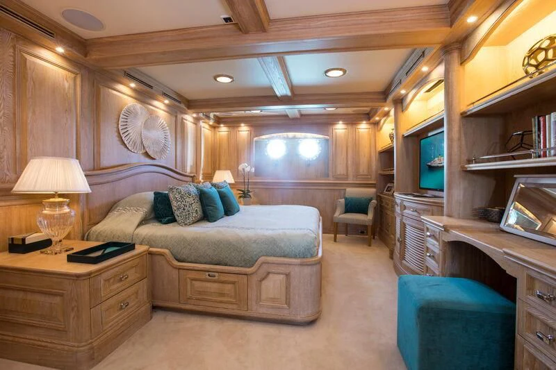 a room with a bed and a desk aboard NERO Yacht for Sale