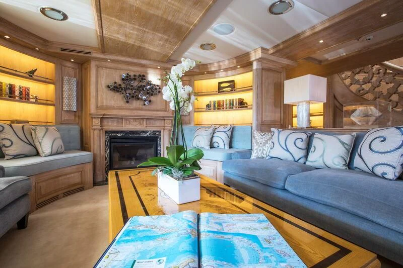 a living room with a fireplace aboard NERO Yacht for Sale