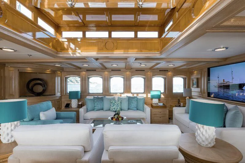 a living room with a couch and a television aboard NERO Yacht for Sale