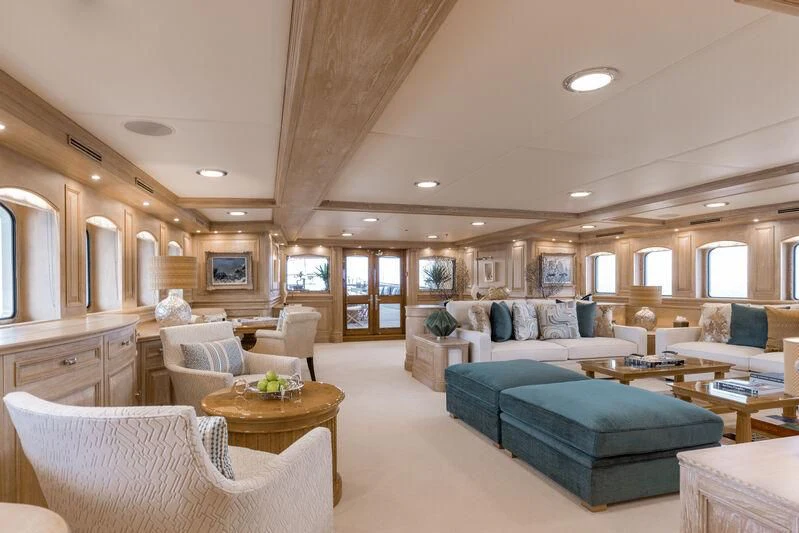 a living room with a couch and a table aboard NERO Yacht for Sale