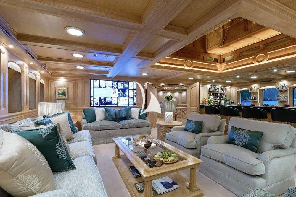 a living room with a couch and a table aboard NERO Yacht for Sale