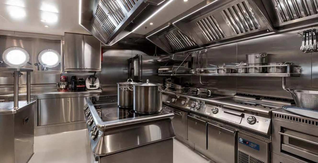 a kitchen with stainless steel appliances aboard NERO Yacht for Sale