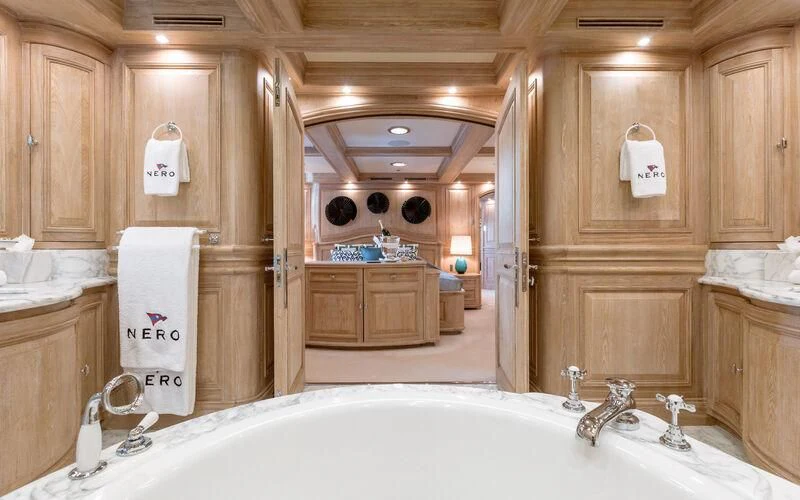 a bathroom with a bathtub and a sink aboard NERO Yacht for Sale