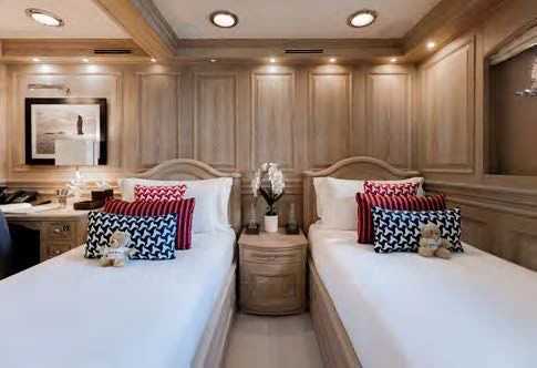 a couple of beds in a hotel room aboard NERO Yacht for Sale
