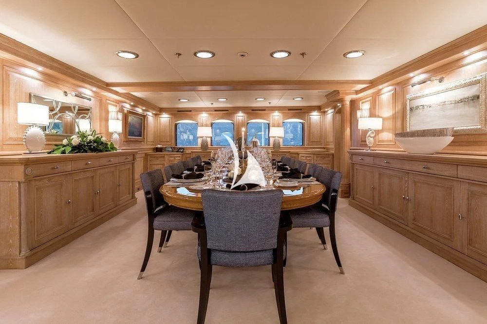 a kitchen with a dining table aboard NERO Yacht for Sale