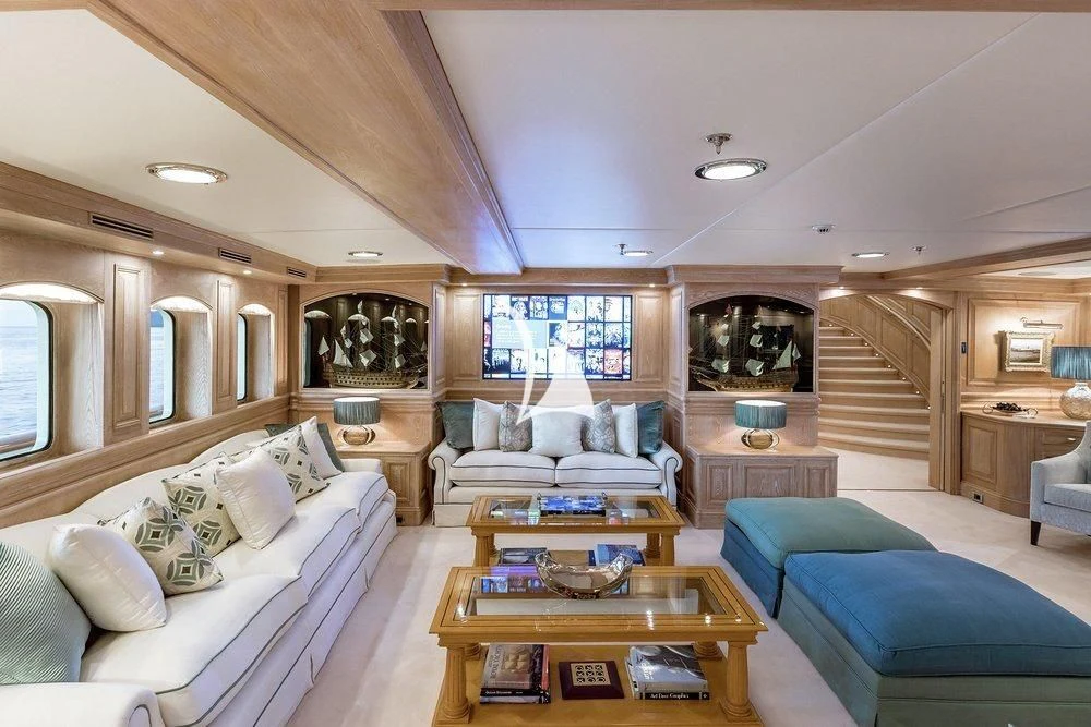 a living room with a staircase aboard NERO Yacht for Sale