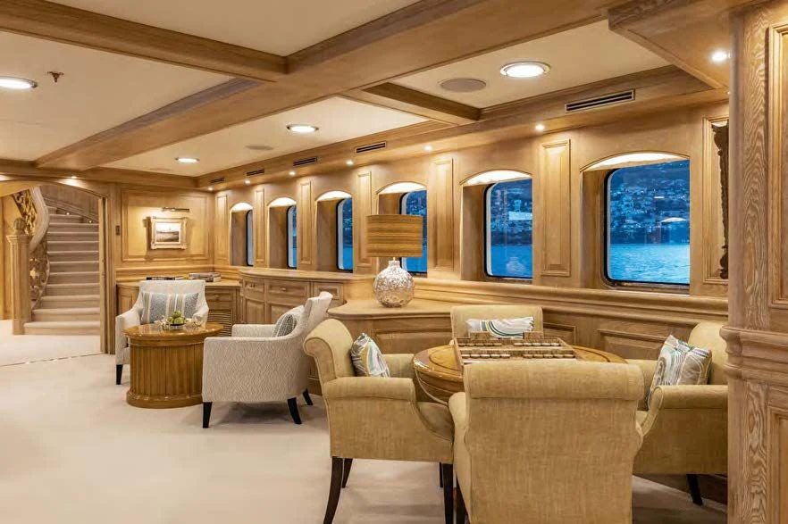 a living room with a staircase aboard NERO Yacht for Sale