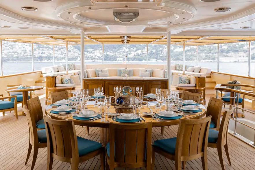 a dining room with a table set aboard NERO Yacht for Sale