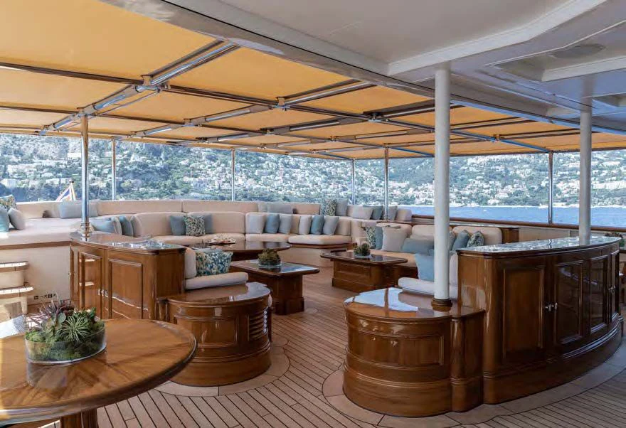 a large living room with a large window aboard NERO Yacht for Sale