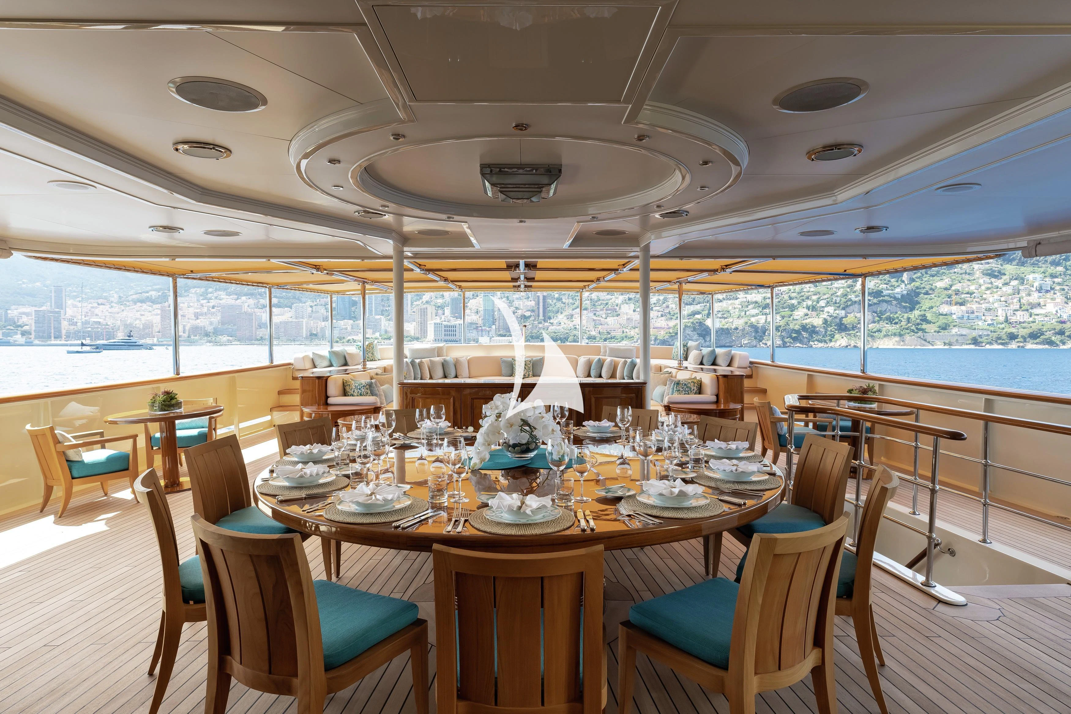 a dining room with a large window aboard NERO Yacht for Sale