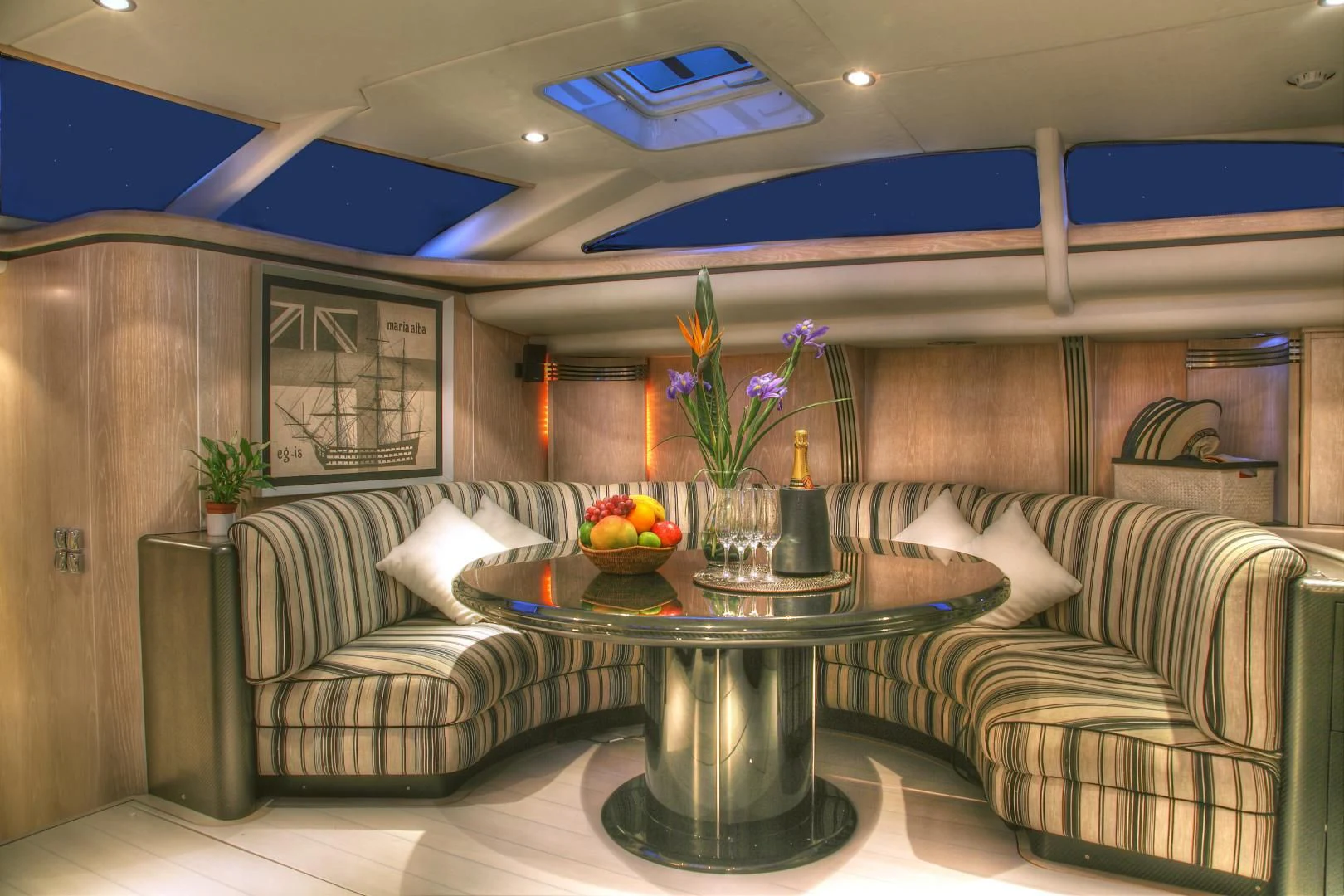 a living room with a couch and a coffee table aboard MARIA ALBA II Yacht for Sale
