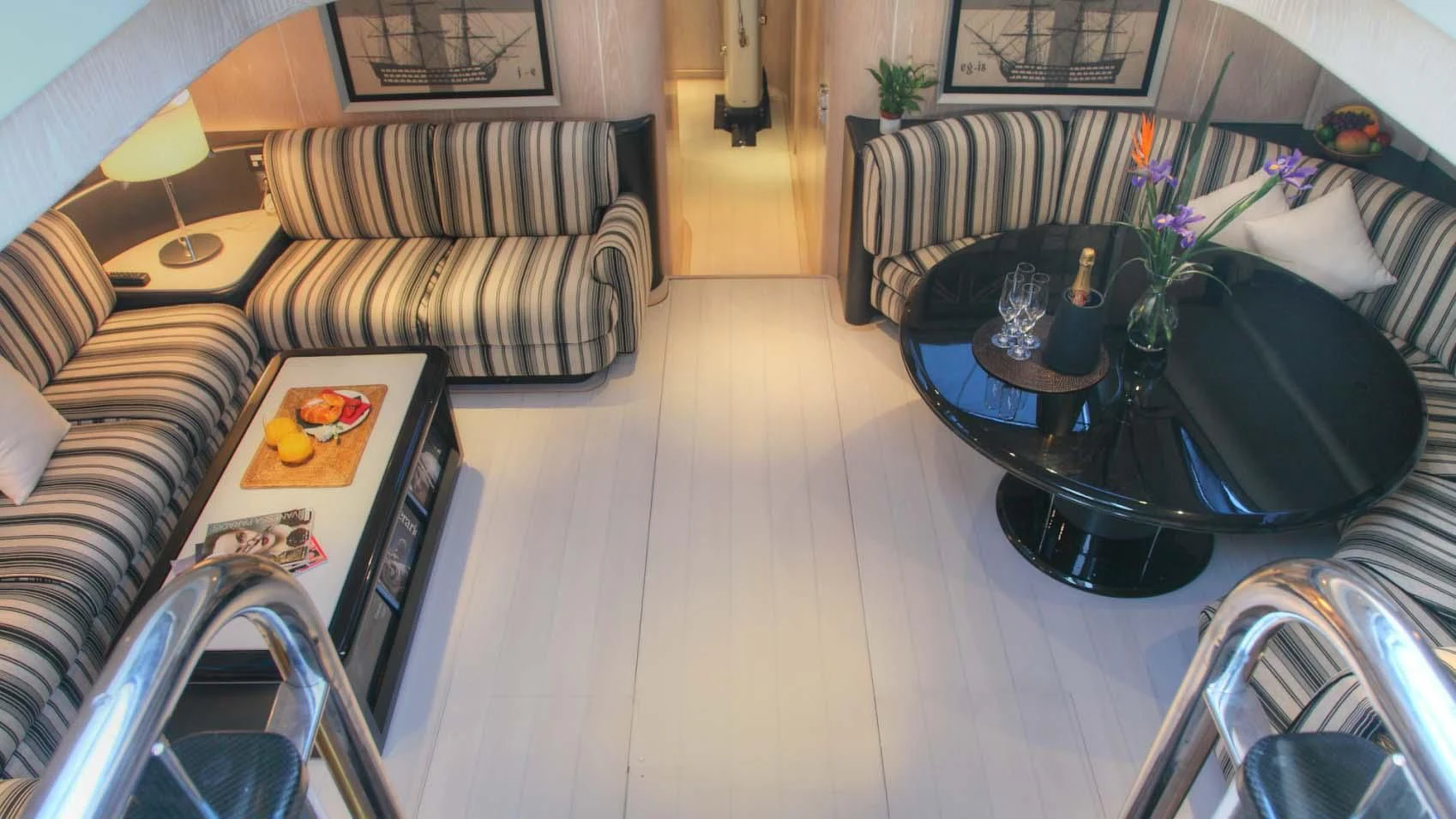 a living room with a couch and a coffee table aboard MARIA ALBA II Yacht for Sale
